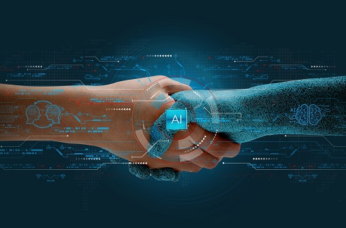 main humaine serrant la main d'un robot